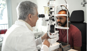 Man at eye exam with Doctor